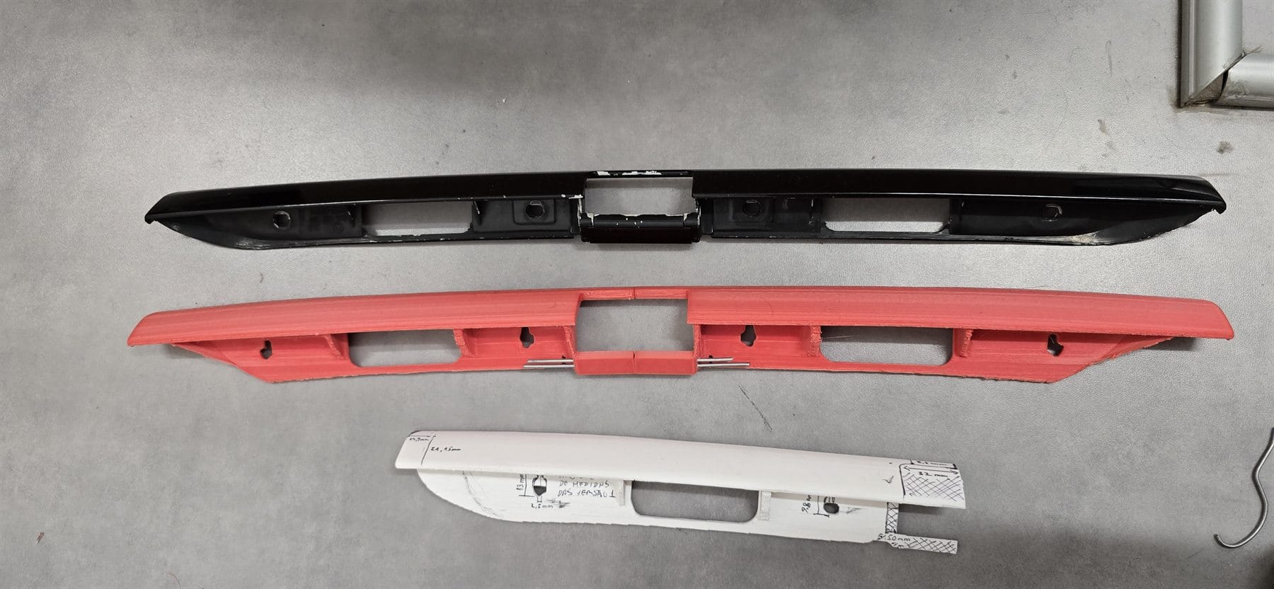 Prototype automotive trim compared with original and measurement template