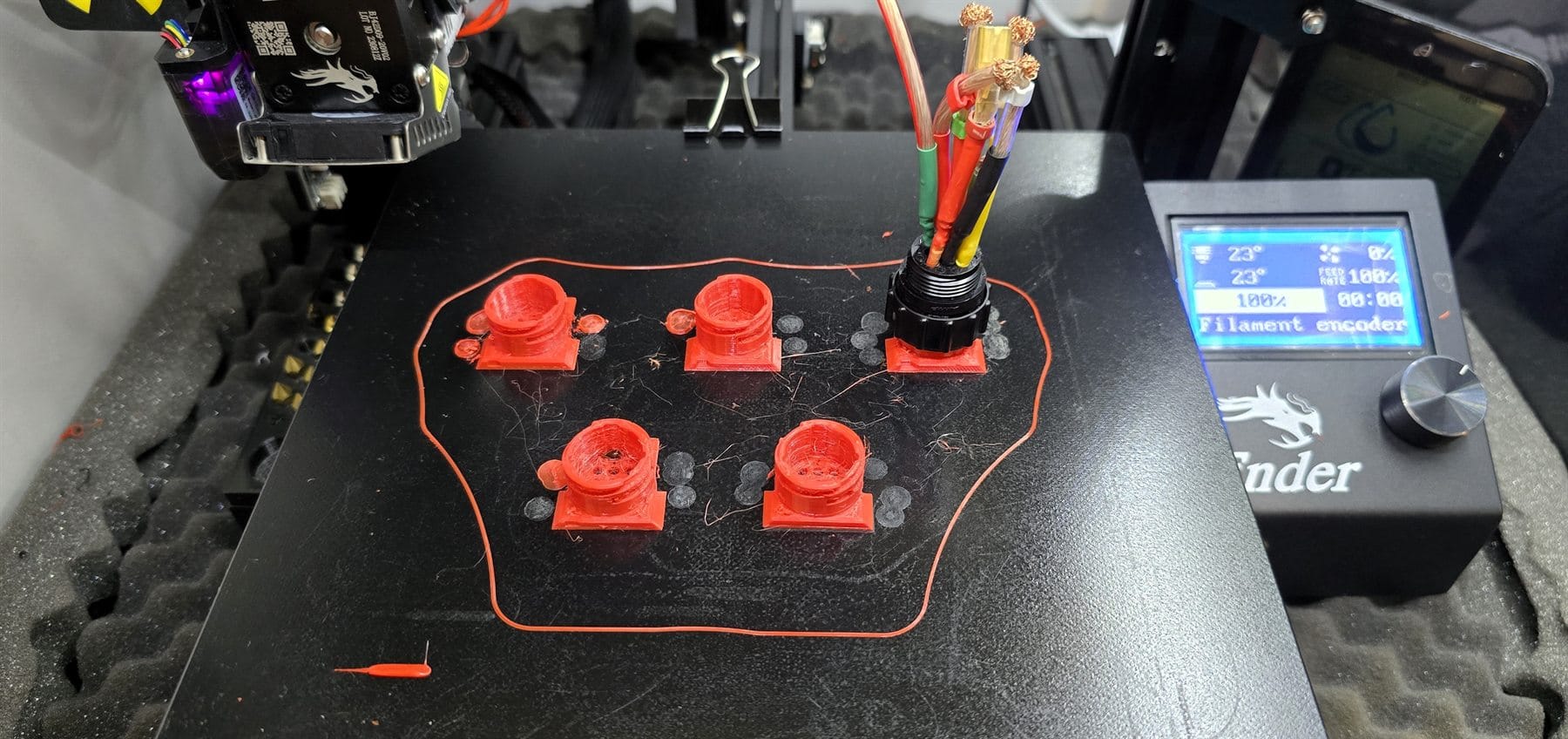FDM prototype parts on a printer bed